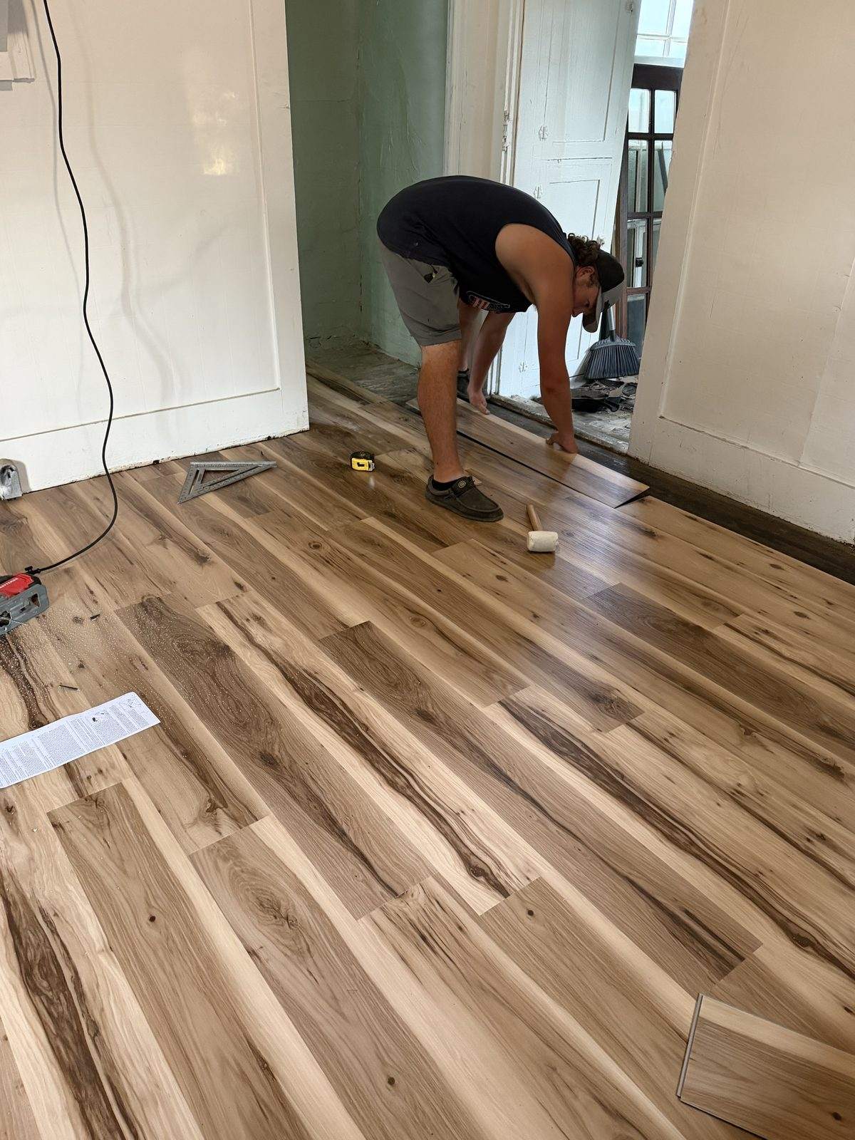 Flooring being installed during a B&G short-term rental build-out